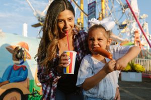 Mom and Daughter enjoying Hot Dog on a Stick