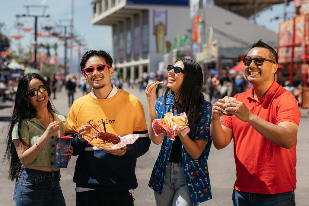 Friends Enjoying Food at Fair